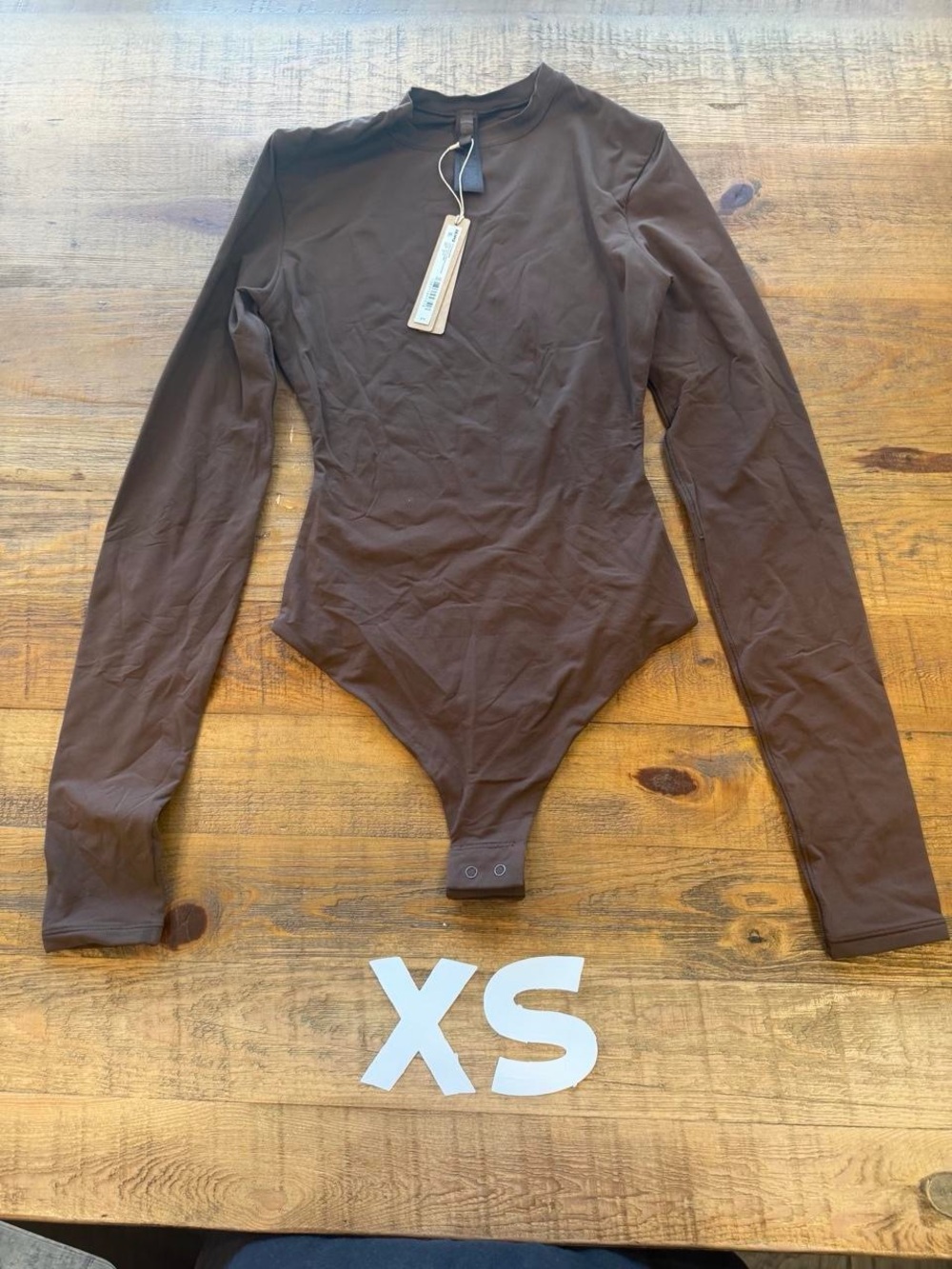 SKIMS Long Sleeve One-Piece Bodysuit in Cocoa XS